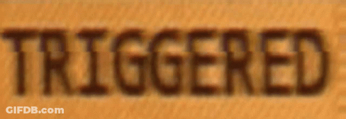 A Close Up Of The Word Triggered On A Wooden Surface GIF