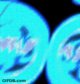 A Close Up Of Two Blue Circles On A Black Background That Looks Like A Smiley Face GIF