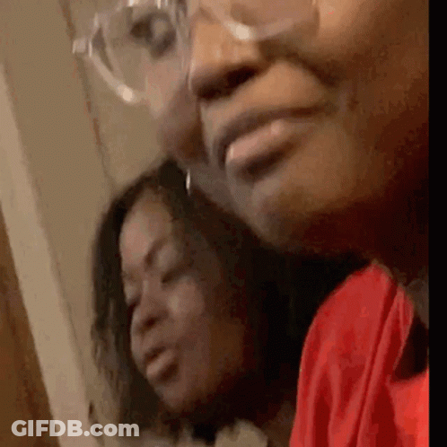 A Close Up Of Two Women 'S Faces With Glasses . GIF