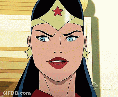 A Close Up Of Wonder Woman 'S Face With An Ign Logo In The Background GIF