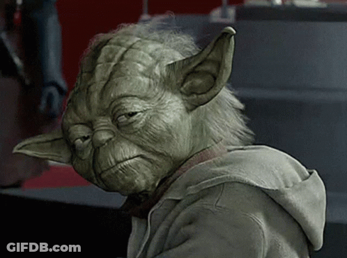 A Close Up Of Yoda Wearing A Hoodie With A Sad Look On His Face GIF