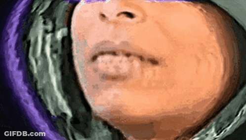 A Closeup Of A Person 'S Face With A Purple Background GIF