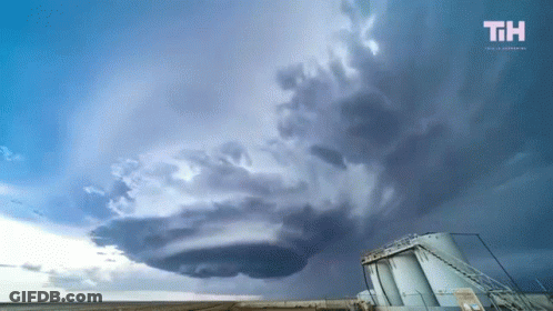 A Cloudy Sky With The Letters Th On The Bottom Left GIF