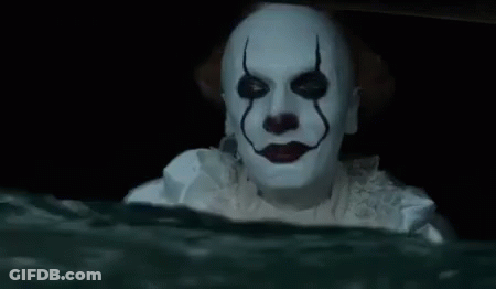 A Clown Is Holding A Slice Of Pizza In His Hand In The Water . GIF