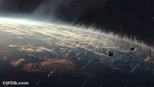 A Cluster Of Asteroids Are Falling From The Sky Over The Earth GIF