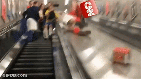 A Cnn Logo Is Flying Over A Group Of People Riding An Escalator GIF