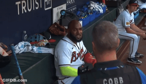 A Cobb Police Officer Talks To A Baseball Player GIF