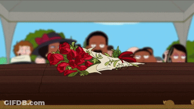 A Coffin With A Bouquet Of Red Roses Laying On It GIF