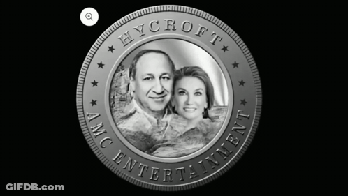 A Coin That Says Hycroft Amc Entertainment With A Picture Of A Man And Woman GIF