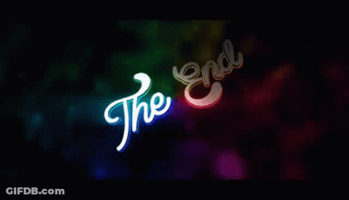 A Colorful Background With The Words `` The End '' Glowing In The Dark . GIF