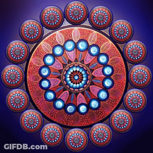 A Colorful Circular Pattern With Blue Circles And Leaves GIF