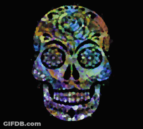 A Colorful Day Of The Dead Skull With Flowers On It GIF