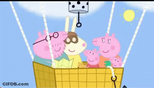 A Colorful Hot Air Balloon Is Flying In The Sky With The Sun In The Background GIF