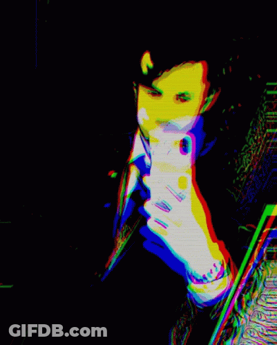 A Colorful Image Of A Man Holding A Cell Phone GIF
