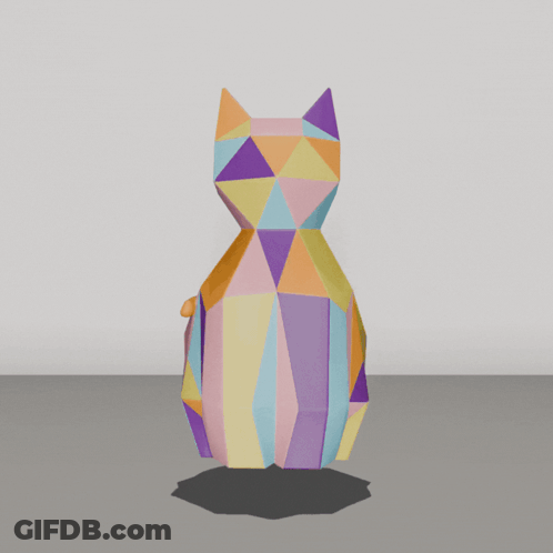 A Colorful Origami Cat Is Sitting On The Ground GIF