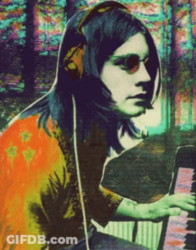 A Colorful Painting Of A Woman Playing A Piano GIF