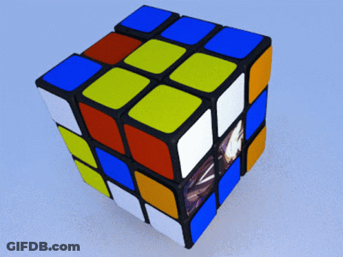 A Colorful Rubik 'S Cube With A Picture Of A Person On It GIF
