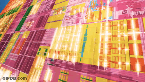A Computer Chip Is Shown In A Very Colorful Display GIF
