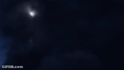 A Computer Generated Image Of A Robot With A Purple Light Coming Out Of It GIF