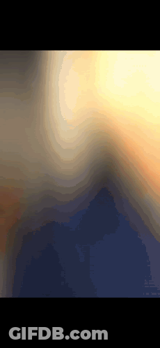 A Computer Generated Image Of A Sunset With Mountains In The Distance GIF