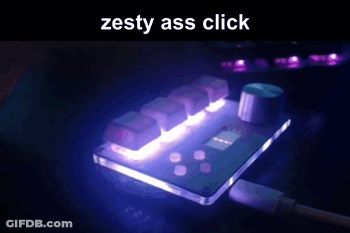 A Computer Keyboard With The Words Zesty Ass Click Written On It GIF