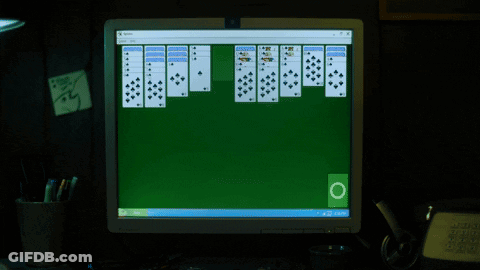 A Computer Monitor Displaying A Game Of Solitaire GIF