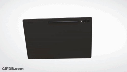 A Computer Monitor Is Displaying A Colorful Image On A White Wall GIF
