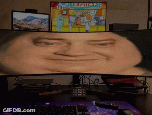 A Computer Monitor Shows A Man 'S Face In Front Of A Sign For Express GIF