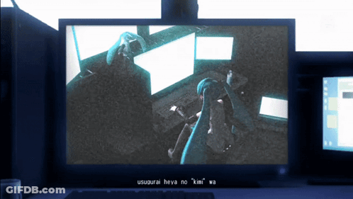 A Computer Monitor Shows A Person Sitting In Front Of A Computer And The Words Usugurai Theya No Kimi Wa On The Bottom GIF