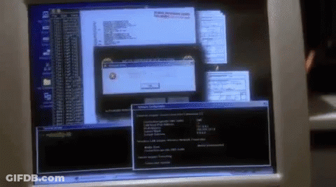 A Computer Monitor With A Few Windows Open Including One That Says Windows Error GIF