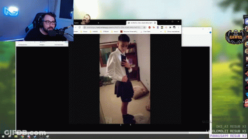 A Computer Screen Shows A Man Speaking Into A Microphone And A Woman In A Skirt GIF