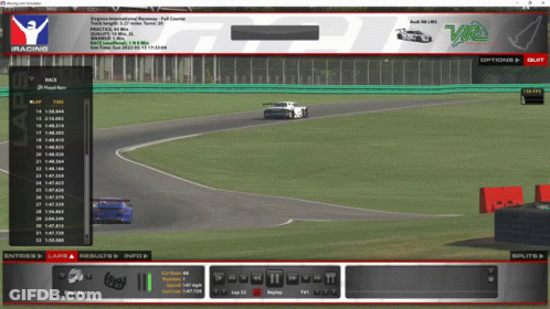 A Computer Screen Shows A Racing Game Being Played On A Track GIF