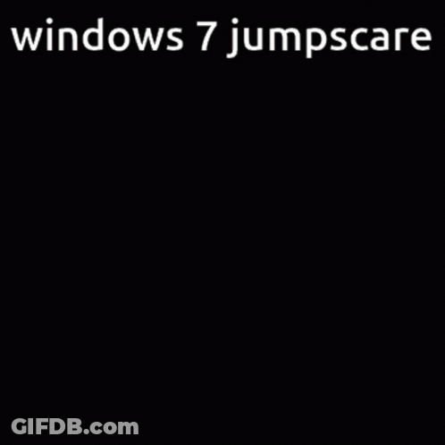 A Computer Screen With The Words Windows 7 Jumpscare On The Bottom GIF