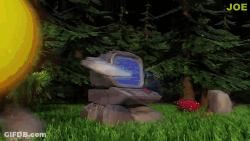 A Computer Sitting In The Grass With The Word Joe In The Corner GIF