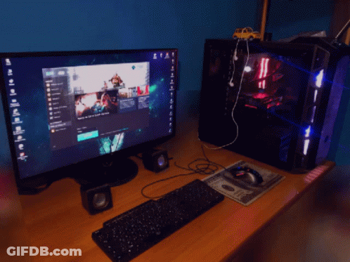 A Computer With A Keyboard And Mouse On A Desk With A Dollar Bill On It GIF