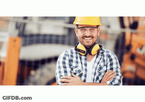 A Construction Worker Wearing A Hard Hat And Ear Protectors GIF