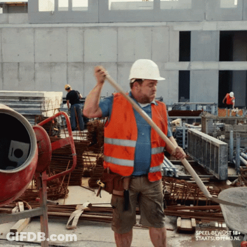 A Construction Worker Wearing An Orange Vest And A White Hard Hat Is Holding A Shovel GIF