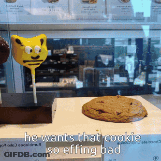 A Cookie And A Lollipop Are On A Table With The Words He Wants That Cookie So Effing Bad GIF