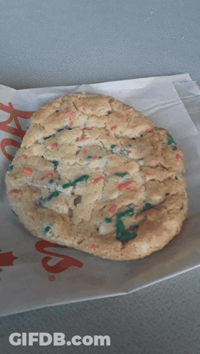 A Cookie Is Sitting On A Piece Of Paper That Says ' Chick-Fil-A ' GIF