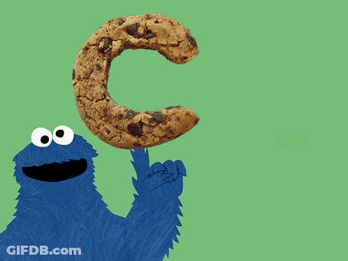 A Cookie Monster Holds A Cookie In The Shape Of The Letter C GIF