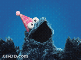 A Cookie Monster Wearing A Pink Party Hat Looks Up At The Sky GIF