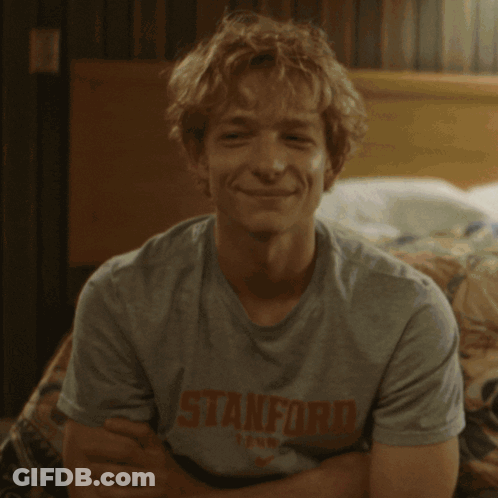 A Cookie With Blue Eyes And A White Smile GIF
