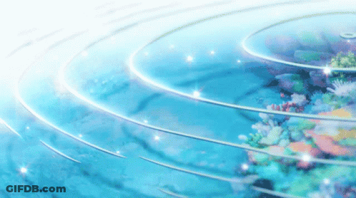 A Coral Reef In The Ocean With A Circle Of Water Surrounding It GIF