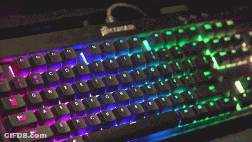 A Corsair Keyboard Has A Rainbow Of Lights On The Keys GIF