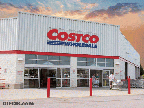 A Costco Wholesale Store With A Red And Blue Sign GIF