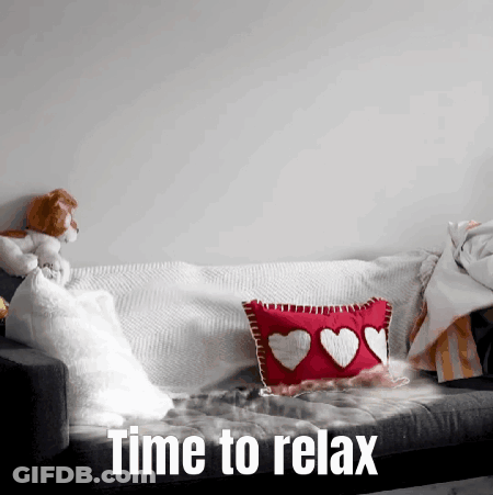 A Couch With A Pillow With Hearts On It And The Words Time To Relax Below It GIF