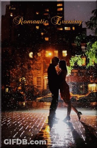 A Couple Kissing In The Rain With The Words Romantic Evening GIF