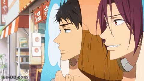 A Couple Of Anime Characters Are Standing In Front Of A Store With Chinese Writing On It GIF