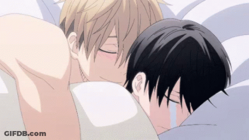 A Couple Of Anime Characters Hugging Each Other In Bed GIF