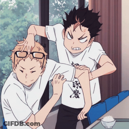 A Couple Of Anime Characters One Of Whom Is Wearing A Shirt With Chinese Writing GIF